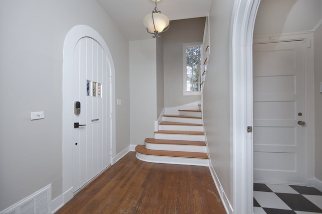 entrance foyer with dark hardwood / wood-style floors