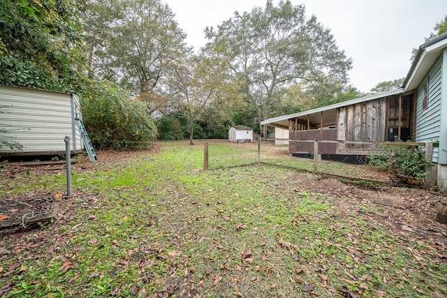 view of yard with a storage unit