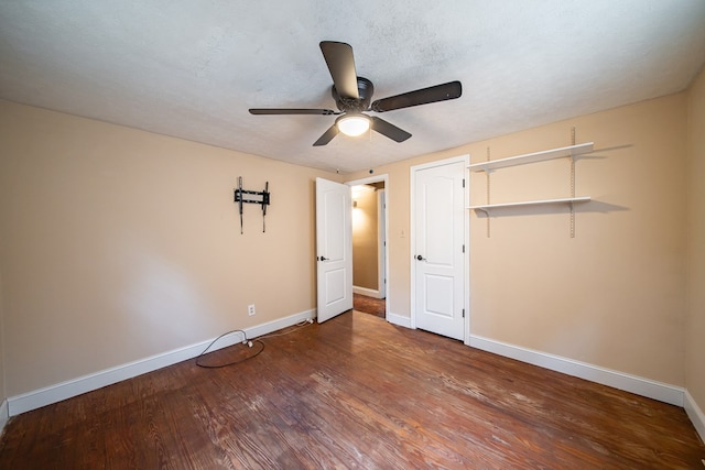 unfurnished bedroom with hardwood / wood-style floors, ceiling fan, a textured ceiling, and a closet