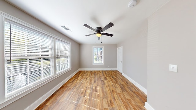 empty room featuring ceiling fan and light hardwood / wood-style floors