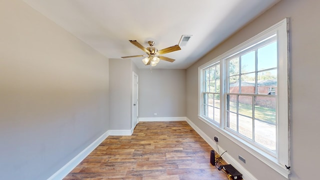 unfurnished room featuring ceiling fan and light wood-type flooring