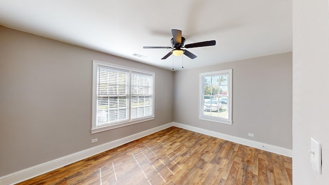 unfurnished room with light hardwood / wood-style flooring and ceiling fan