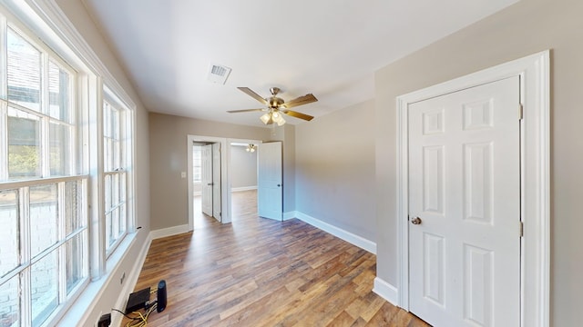 unfurnished room with light hardwood / wood-style flooring and ceiling fan