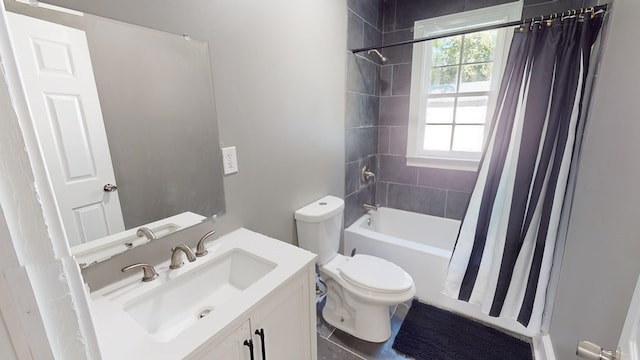 full bathroom featuring tile patterned floors, vanity, toilet, and shower / tub combo with curtain