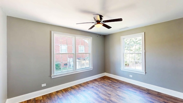 unfurnished room with hardwood / wood-style flooring, ceiling fan, and a wealth of natural light