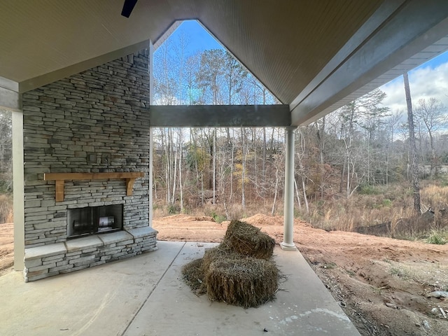 view of patio with an outdoor stone fireplace