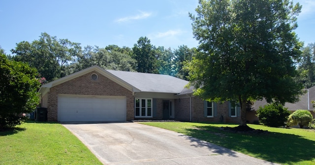 7265 E Wynfield Loop, Midland, GA 31820 - ranch-style home with an attached garage, concrete driveway, and a front lawn