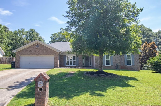 7265 E Wynfield Loop, Midland, GA 31820 - view of front of home featuring an attached garage, driveway, and brick siding
