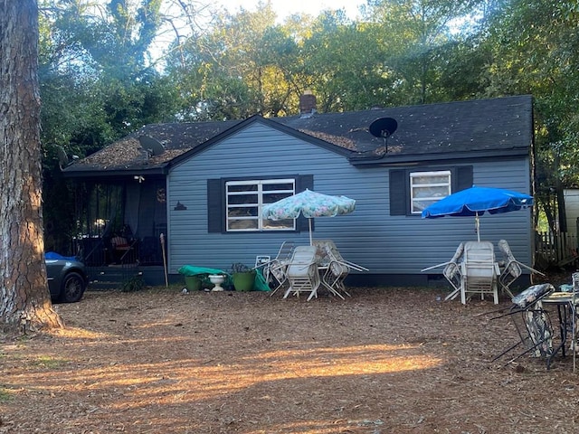 rear view of house with a sunroom