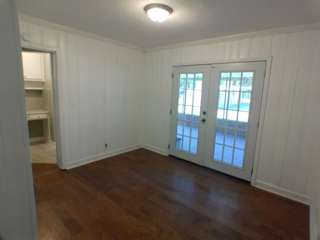 entryway featuring dark hardwood / wood-style flooring and french doors