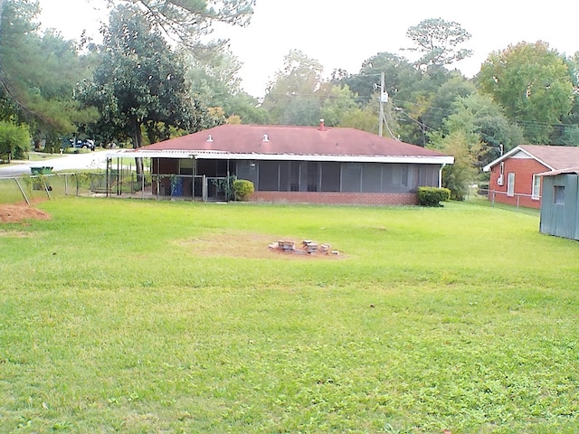 view of yard with a sunroom