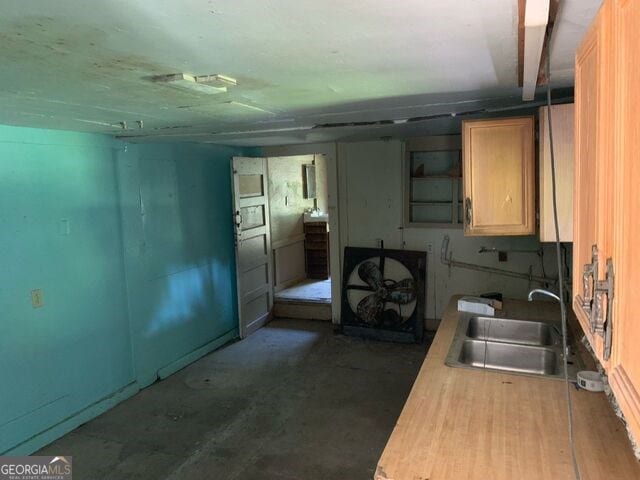 kitchen with a sink and light countertops