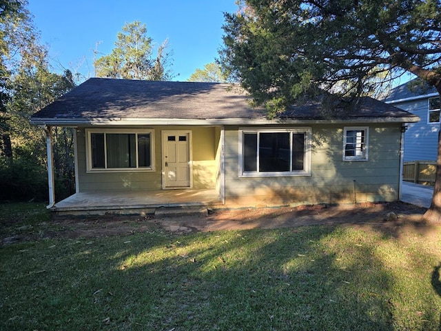 2879 Grant Rd, Columbus, GA 31907 - view of front of house featuring covered porch, a front lawn, and a shingled roof