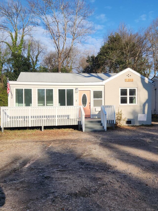 entrance to property featuring a deck