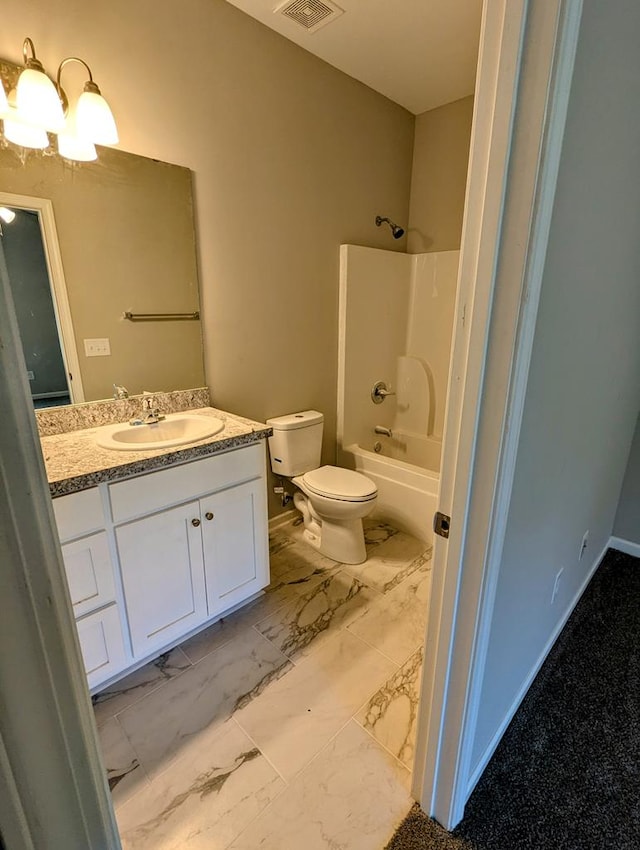 full bathroom featuring toilet, vanity, a chandelier, and tub / shower combination