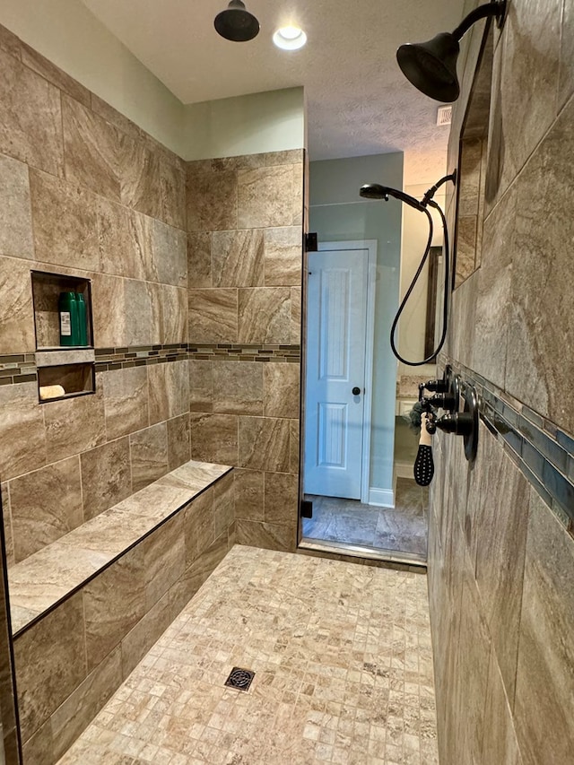 bathroom featuring tiled shower