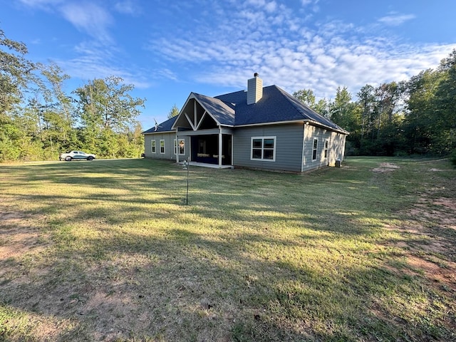 back of house with a yard