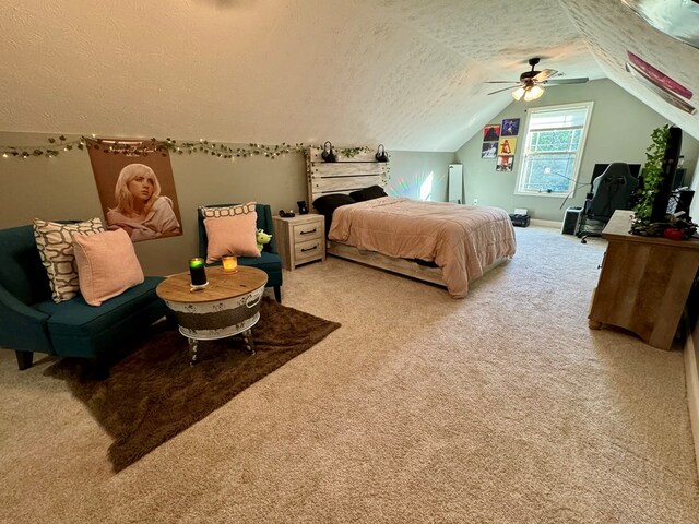 carpeted bedroom with lofted ceiling, ceiling fan, and a textured ceiling