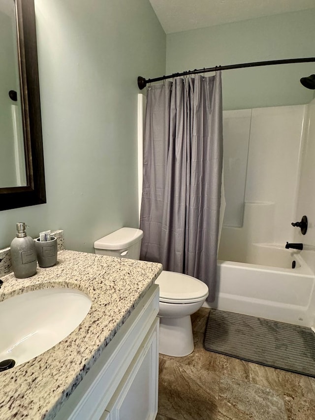 full bathroom with vanity, toilet, and shower / tub combo with curtain