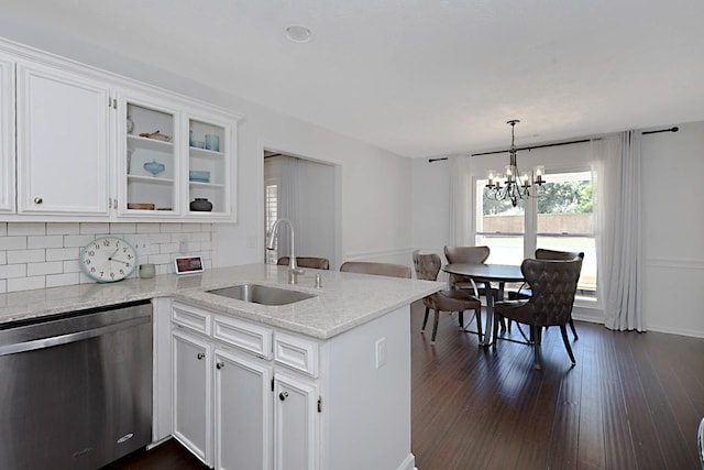 7191 Otter Dr, Midland, GA 31820 - kitchen featuring dishwasher, a sink, a peninsula, white cabinets, and decorative backsplash