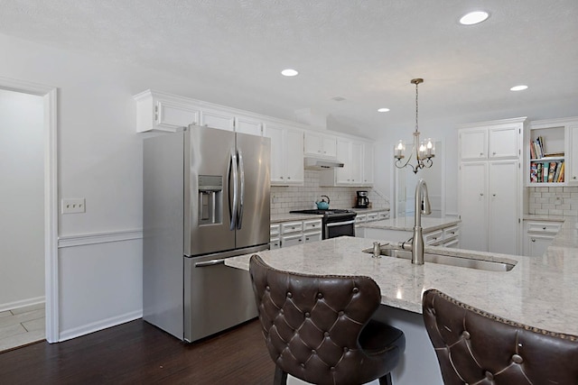 7191 Otter Dr, Midland, GA 31820 - kitchen with appliances with stainless steel finishes, a sink, tasteful backsplash, white cabinets, and light stone countertops