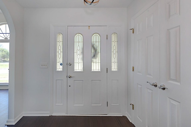 7191 Otter Dr, Midland, GA 31820 - entryway featuring arched walkways, dark wood-style flooring, and baseboards
