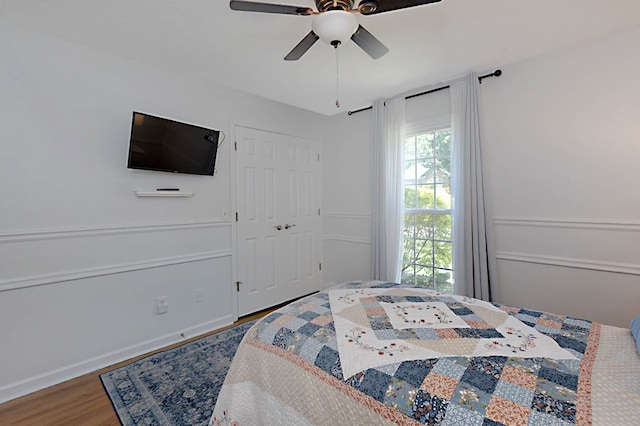 7191 Otter Dr, Midland, GA 31820 - bedroom with wood finished floors, ceiling fan, baseboards, and a closet