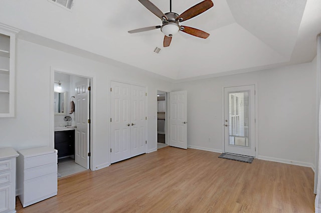 7191 Otter Dr, Midland, GA 31820 - unfurnished bedroom featuring light wood finished floors, connected bathroom, baseboards, and ceiling fan
