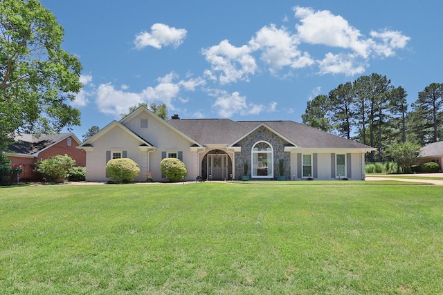 7191 Otter Dr, Midland, GA 31820 - view of front of property featuring a front yard, a chimney, and stucco siding