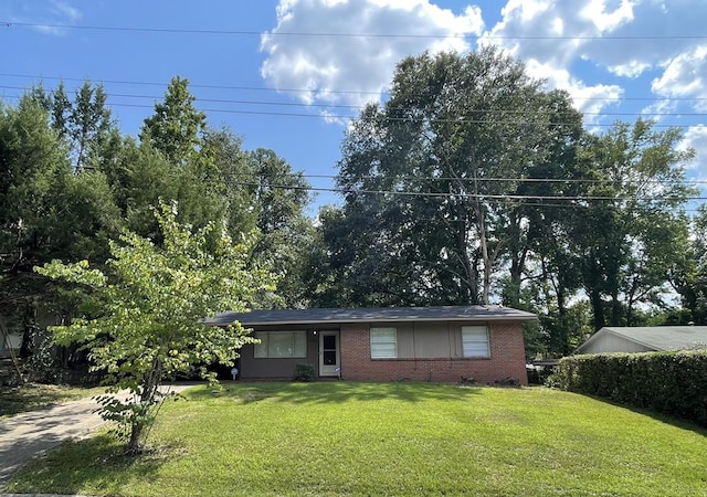single story home with brick siding and a front yard