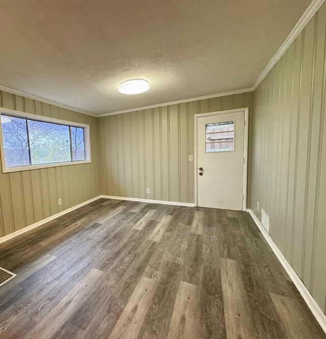 4044 Norwood Dr, Columbus, GA 31907 - spare room with visible vents, ornamental molding, a textured ceiling, wood finished floors, and baseboards