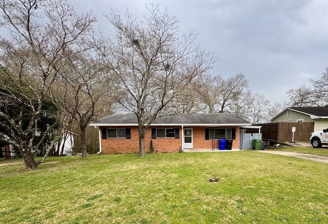 4044 Norwood Dr, Columbus, GA 31907 - single story home featuring brick siding, driveway, a front lawn, and fence