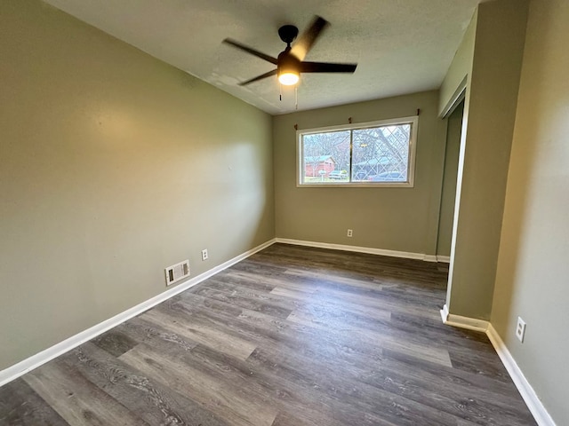 4044 Norwood Dr, Columbus, GA 31907 - unfurnished bedroom featuring visible vents, baseboards, a closet, a textured ceiling, and dark wood-style flooring