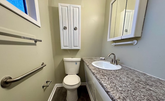 4044 Norwood Dr, Columbus, GA 31907 - bathroom featuring toilet, vanity, baseboards, and wood finished floors