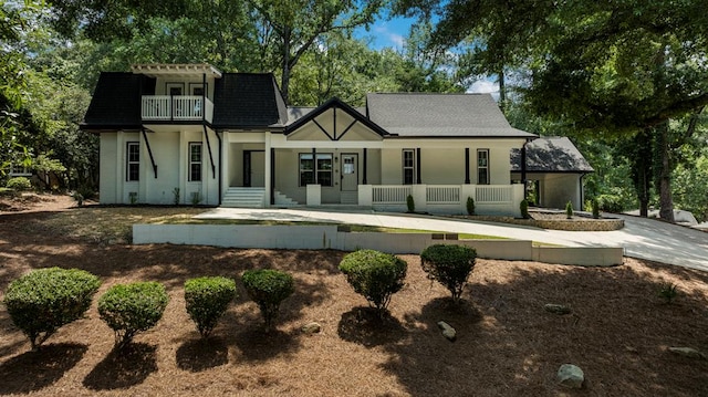 7209 Lullwater Rd, Columbus, GA 31904 - rear view of property with covered porch, a balcony, and roof with shingles
