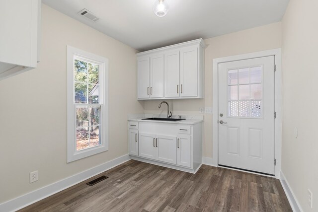 7209 Lullwater Rd, Columbus, GA 31904 - laundry area featuring dark wood finished floors