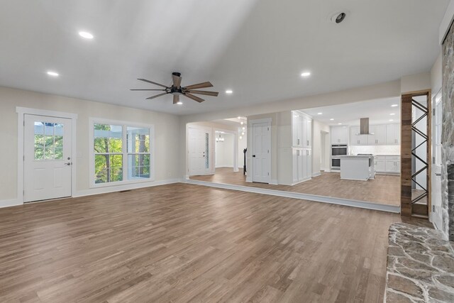 7209 Lullwater Rd, Columbus, GA 31904 - unfurnished living room featuring light wood-type flooring, ceiling fan, and recessed lighting
