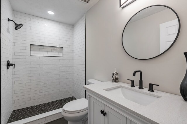 7209 Lullwater Rd, Columbus, GA 31904 - full bathroom with tiled shower, vanity, and recessed lighting