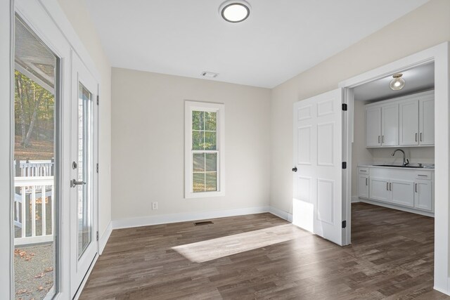 7209 Lullwater Rd, Columbus, GA 31904 - unfurnished dining area featuring dark wood-style floors and a sink