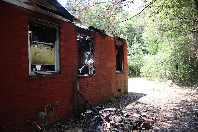 3115 Meade St, Columbus, GA 31903 - view of side of property featuring an outdoor fire pit and a forest view