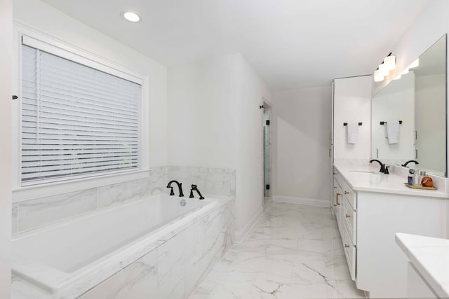 10312 Emerson Way, Midland, GA 31822 - full bathroom with double vanity, a garden tub, marble look tile flooring, and recessed lighting
