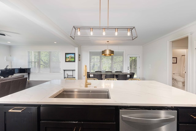 10312 Emerson Way, Midland, GA 31822 - kitchen featuring open floor plan, dark cabinetry, stainless steel dishwasher, a center island with sink, and light stone countertops