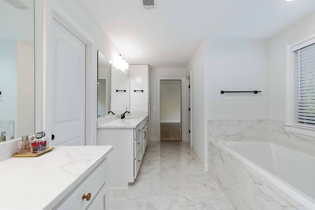 10312 Emerson Way, Midland, GA 31822 - full bath featuring marble tiled flooring, vanity, and a garden tub