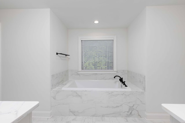 10312 Emerson Way, Midland, GA 31822 - bathroom with a garden tub, marble look tiles, and vanity