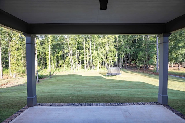 10312 Emerson Way, Midland, GA 31822 - view of patio with a trampoline and a wooded view