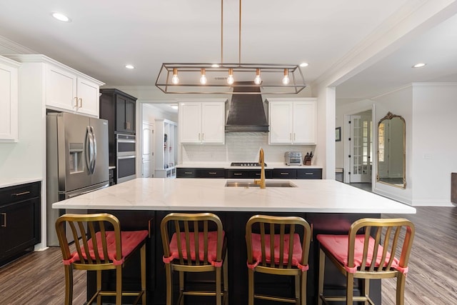 10312 Emerson Way, Midland, GA 31822 - kitchen featuring ornamental molding, appliances with stainless steel finishes, decorative backsplash, dark wood-style flooring, and light stone counters