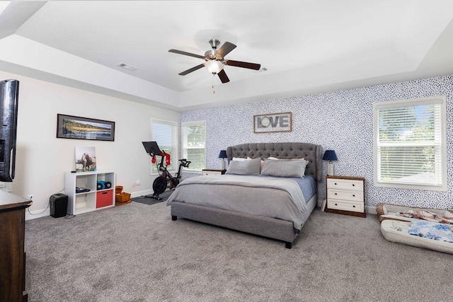 7514 Garrett Rd, Midland, GA 31820 - carpeted bedroom featuring a raised ceiling and a ceiling fan