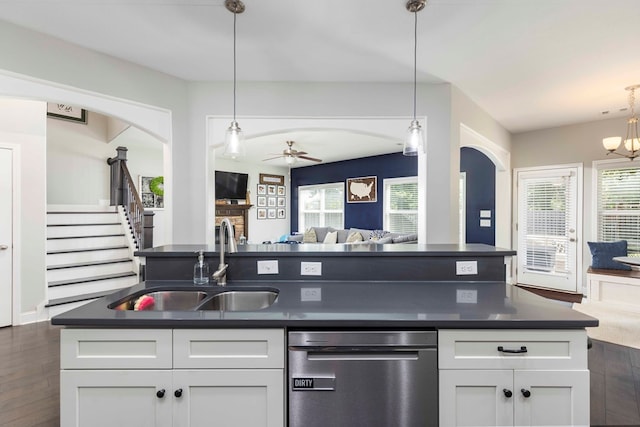 7514 Garrett Rd, Midland, GA 31820 - kitchen with stainless steel dishwasher, dark countertops, dark wood-style floors, and open floor plan