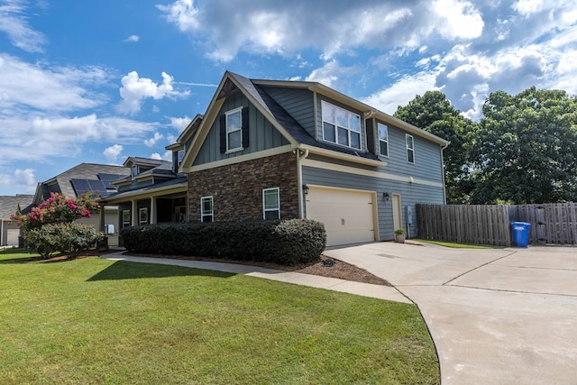 7514 Garrett Rd, Midland, GA 31820 - view of side of property featuring driveway, an attached garage, board and batten siding, and stone siding