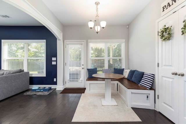 7514 Garrett Rd, Midland, GA 31820 - foyer featuring dark wood-type flooring, a chandelier, and arched walkways